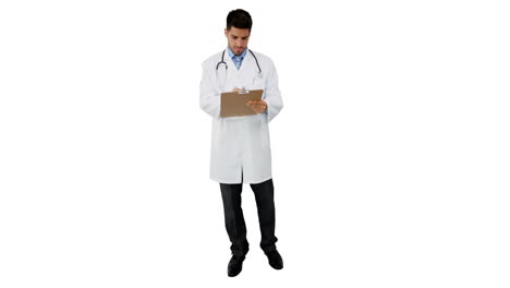 Young-doctor-standing-with-clipboard