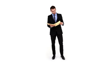 Young-businessman-reading-a-file