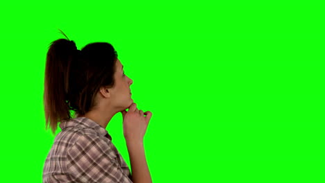 Casual-brunette-thinking-on-green-screen