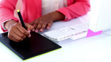 Pretty-designer-working-at-her-desk