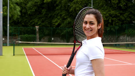 Pretty-tennis-player-smiling-at-camera