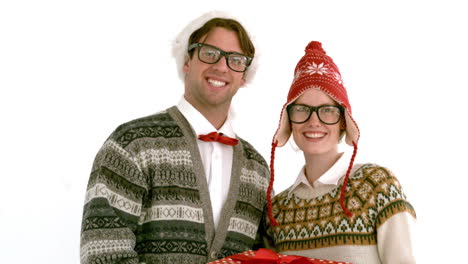 In-slow-motion-geeky-hipster-couple-holding-present