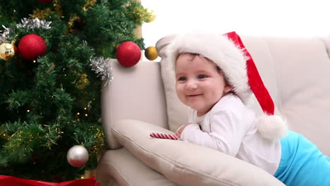 Baby-boy-wearing-santa-hat-on-the-couch