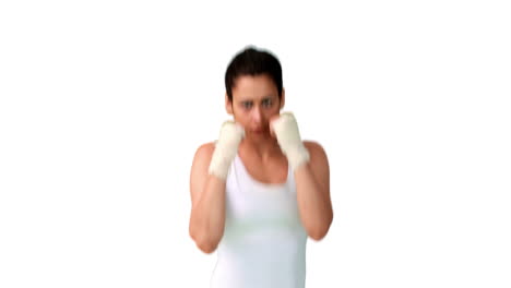 Fit-brunette-punching-with-bandaged-fists