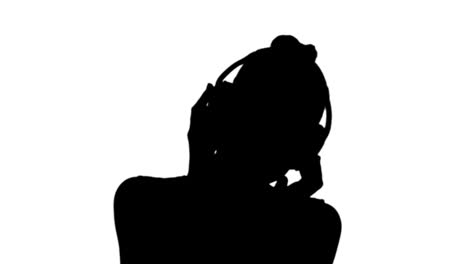 Woman-listening-to-music-in-black-silhouette