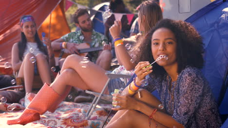 In-high-quality-format-carefree-hipster-blowing-bubbles-in-tent-