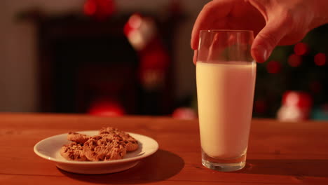 Hand-leaving-cookies-and-milk-out-for-santa
