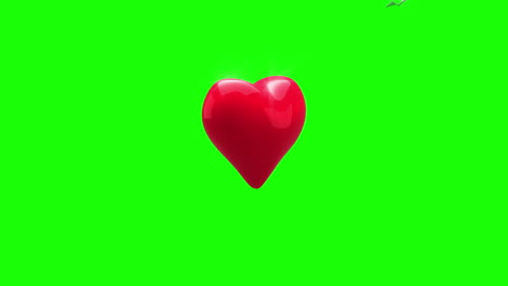 Red-heart-turning-and-exploding-on-green-background