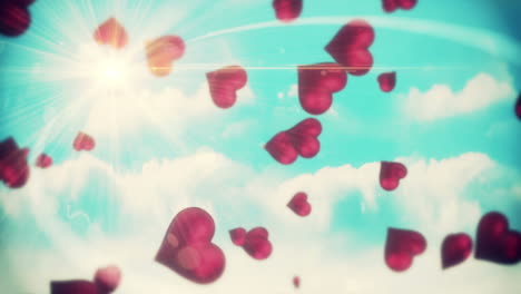 Pink-hearts-floating-against-blue-sky