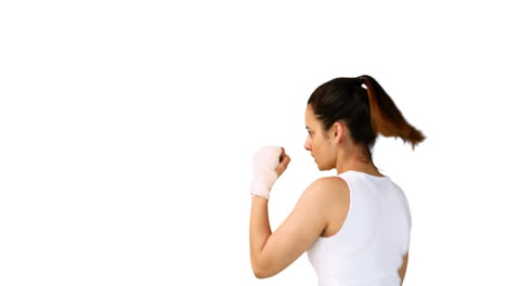 Fit-brunette-punching-with-bandaged-fists