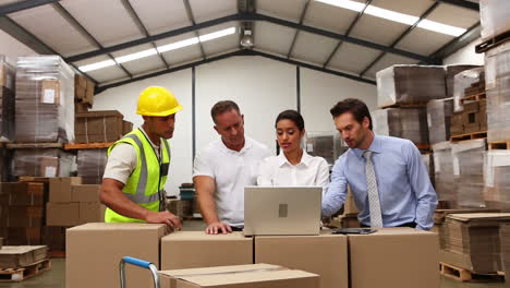 Warehouse-managers-looking-at-laptop