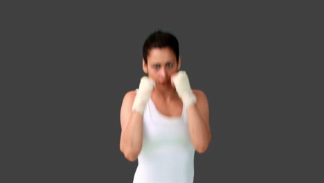 Fit-brunette-punching-with-bandaged-fists