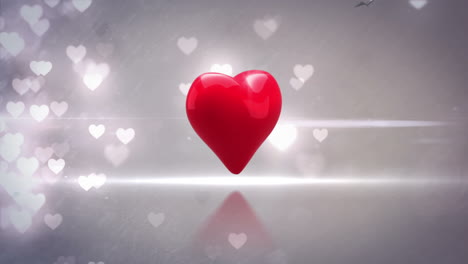 Red-heart-turning-and-exploding-on-glittering-background