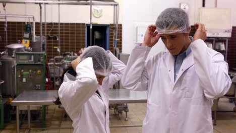 Brewery-workers-putting-on-their-hairnets