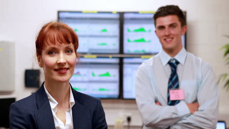 Data-center-colleagues-smiling-at-camera-in-office