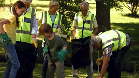 Active-family-collecting-rubbish-in-park