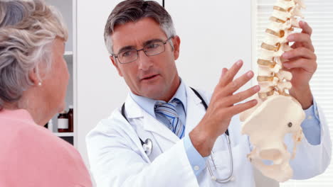 Doctor-explaining-a-spine-model-to-patient