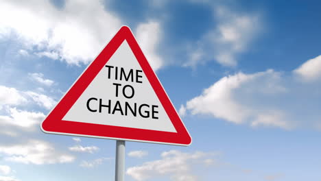 Time-to-change-road-sign-over-cloudy-sky