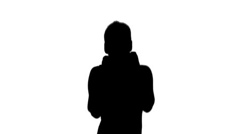 Fit-brunette-punching-in-black-silhouette