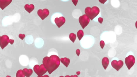 Pink-hearts-floating-against-glittering-background