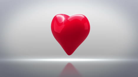 Red-heart-turning-on-grey-background