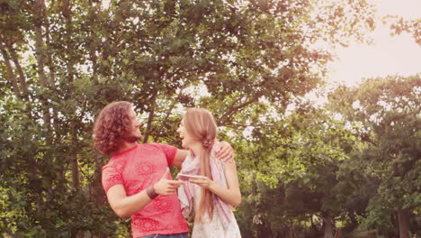 In-slow-motion-friends-using-smartphone-in-the-park