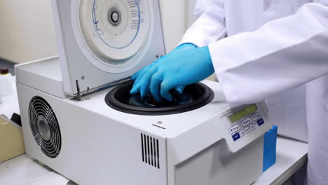 Chemist-using-centrifuge-in-the-lab