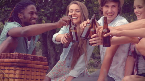 In-high-quality-format-happy-friends-in-the-park-having-a-picnic-