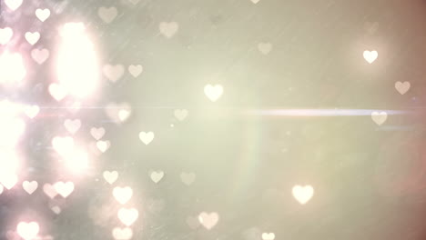 Glittering-hearts-on-pale-background