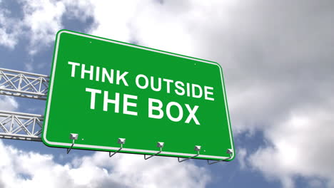 Think-outside-the-box-sign-against-blue-sky-