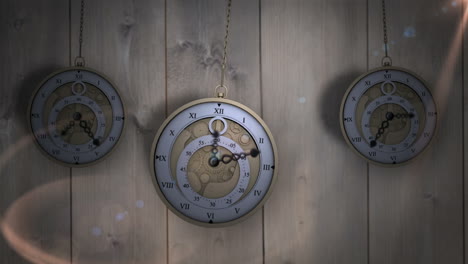 Hanging-pocket-watches-ticking-against-wood