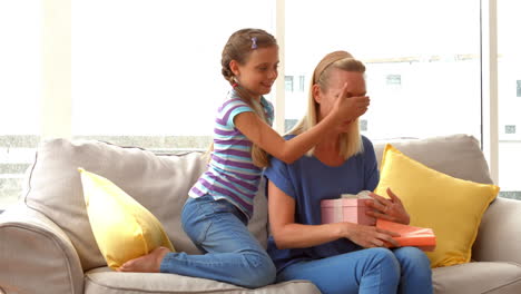 Daughter-surprising-her-mother-with-gift