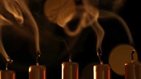 Line-of-lighting-golden-candles-blown-out