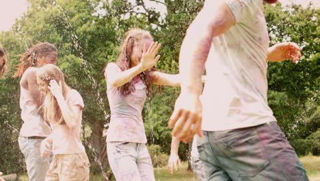 In-slow-motion-happy-friends-covered-in-powder-paint