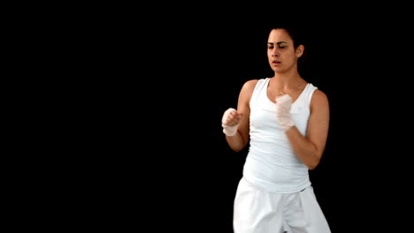 Fit-brunette-punching-with-bandaged-fists