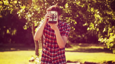 In-high-quality-4k-format-handsome-hipster-with-retro-camera