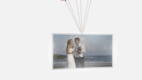 Balloons-carrying-screen-showing-newlywed-couple-on-beach