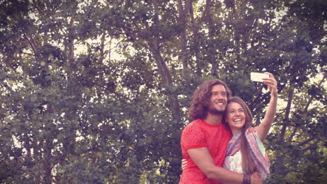 In-high-quality-format-couple-taking-a-selfie-in-the-park