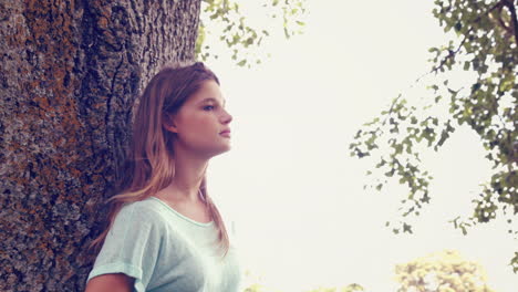 In-high-quality-format-pretty-girl-smiling-at-camera-in-park