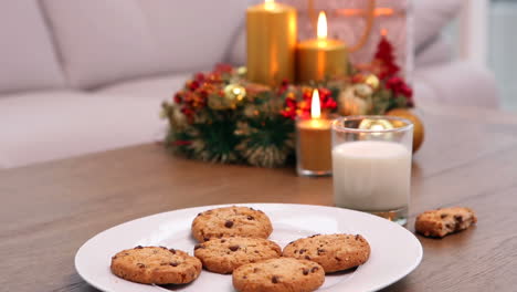 Coffee-table-with-christmas-gift-bag-and-cookies