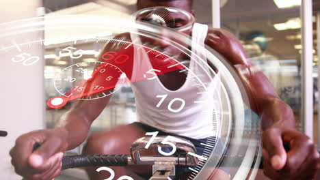 Stopwatch-graphic-over-man-using-exercise-bike
