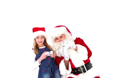 Little-girl-playing-video-games-with-santa