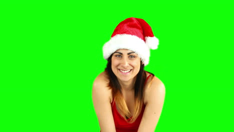 Pretty-girl-in-santa-hat-sending-an-air-kiss-to-camera