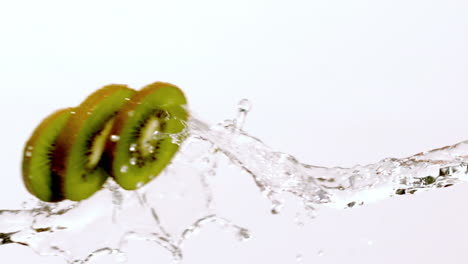 Kiwi-slices-moving-through-stream-of-water