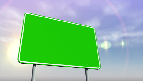 Empty-green-road-sign-against-changing-sky