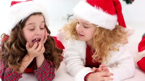 Cute-festive-children-lying-on-the-floor