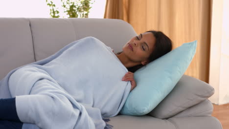 Woman-napping-on-her-couch