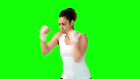 Fit-brunette-punching-with-bandaged-fists