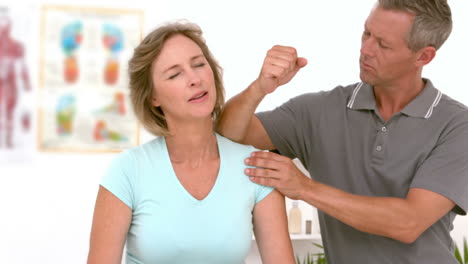 Physiotherapist-doing-shoulder-massage-to-his-patient