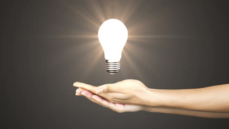 Hand-presenting-light-bulb